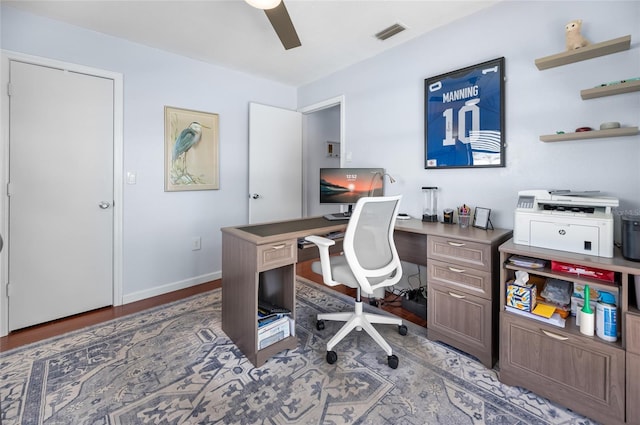 office space with dark hardwood / wood-style floors and ceiling fan