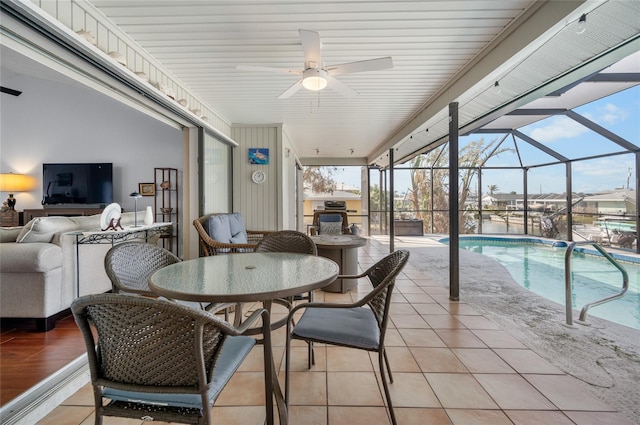 exterior space featuring ceiling fan and a lanai