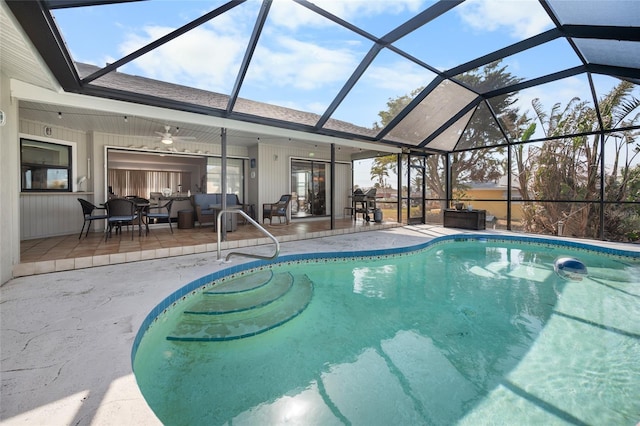 view of pool featuring a lanai, a patio area, ceiling fan, and an outdoor hangout area