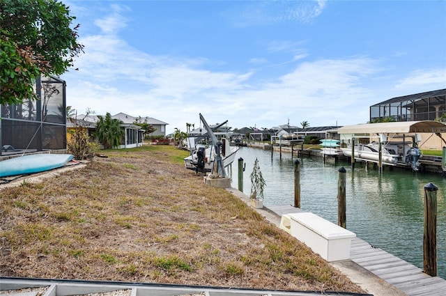 dock area featuring a lanai and a water view