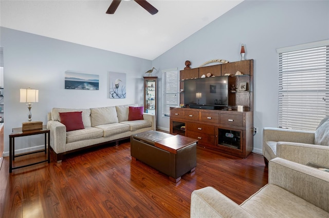 living room with dark hardwood / wood-style floors, ceiling fan, and vaulted ceiling