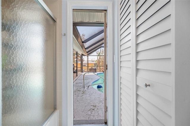 doorway with lofted ceiling