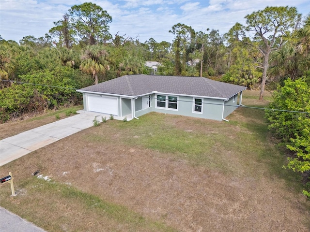 ranch-style home with a front yard and a garage