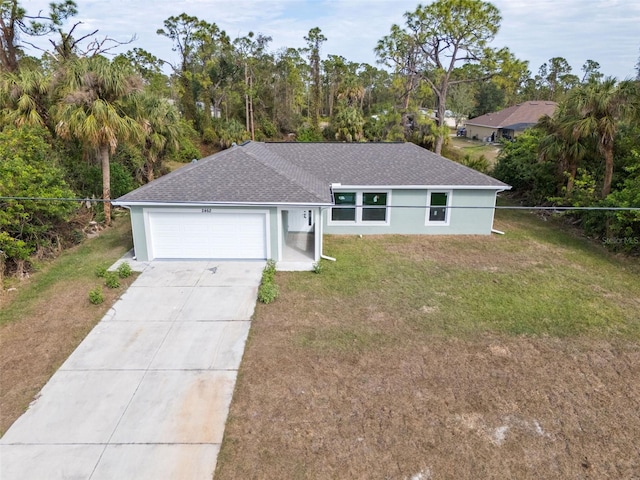 ranch-style house featuring a garage and a front yard