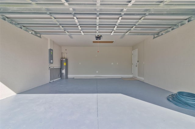 garage featuring electric panel and water heater