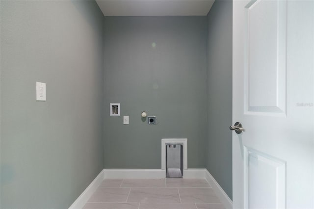 clothes washing area featuring washer hookup, electric dryer hookup, and light tile patterned flooring