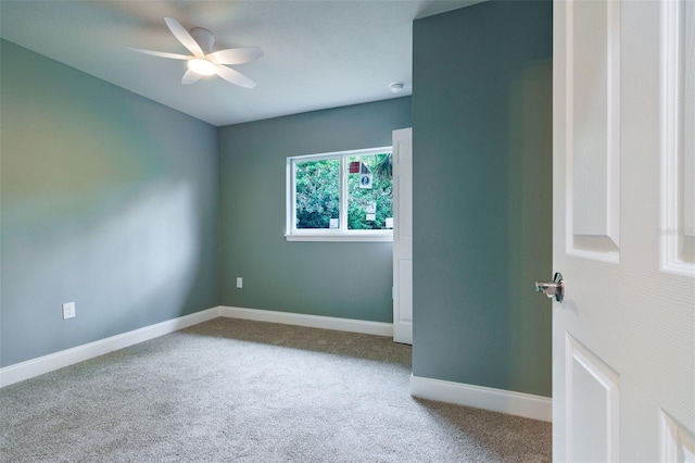 empty room featuring carpet and ceiling fan