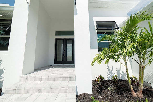 entrance to property featuring french doors