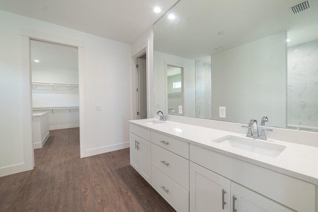 bathroom with vanity and hardwood / wood-style flooring