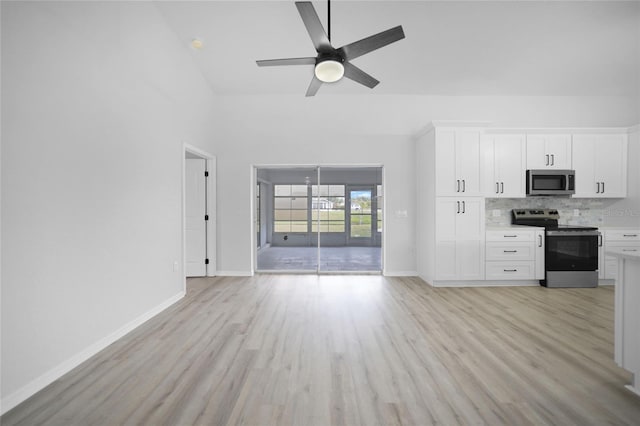 unfurnished living room featuring ceiling fan, high vaulted ceiling, and light hardwood / wood-style floors