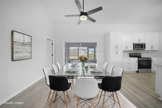 dining area featuring light hardwood / wood-style flooring and ceiling fan