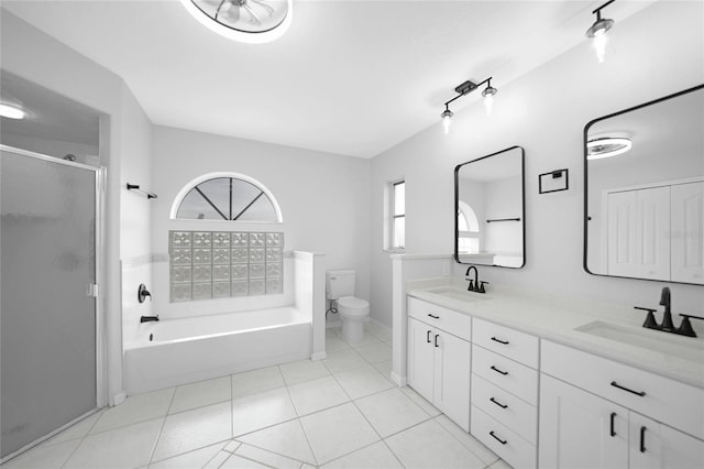 full bathroom featuring vanity, shower with separate bathtub, and toilet