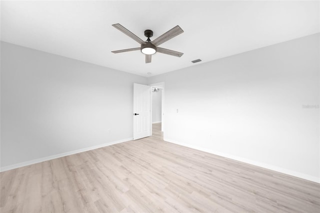 empty room featuring ceiling fan and light hardwood / wood-style floors