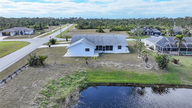 birds eye view of property with a water view