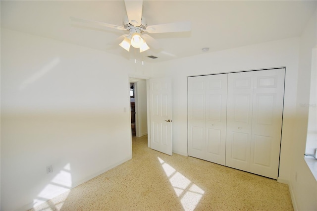 unfurnished bedroom with a closet and ceiling fan