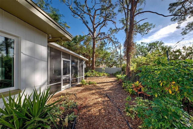 view of yard featuring a sunroom