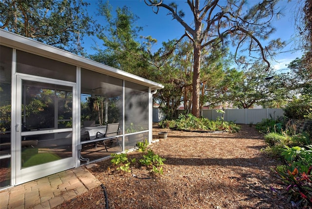 view of yard featuring a sunroom