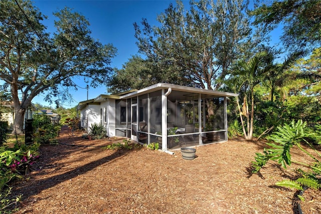 back of house with a sunroom