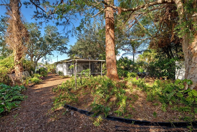 view of yard with a sunroom