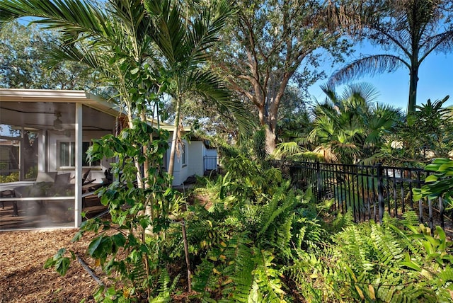 view of yard with a sunroom