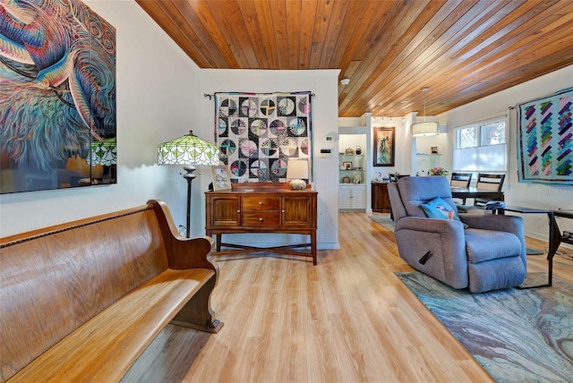 living area with light hardwood / wood-style flooring and wood ceiling