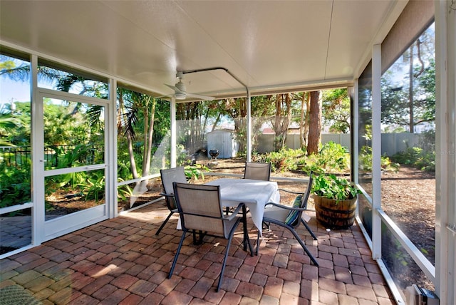 sunroom / solarium with ceiling fan