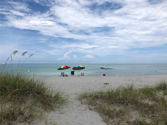 property view of water featuring a beach view