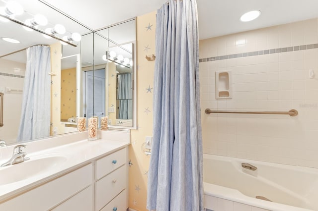 bathroom featuring vanity and shower / tub combo with curtain