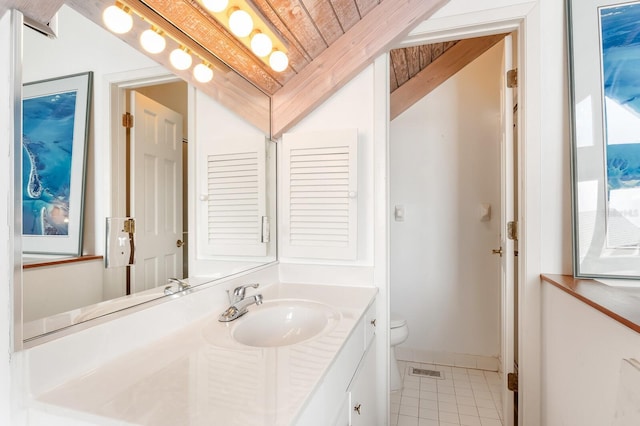 bathroom with toilet, tile patterned floors, and vanity