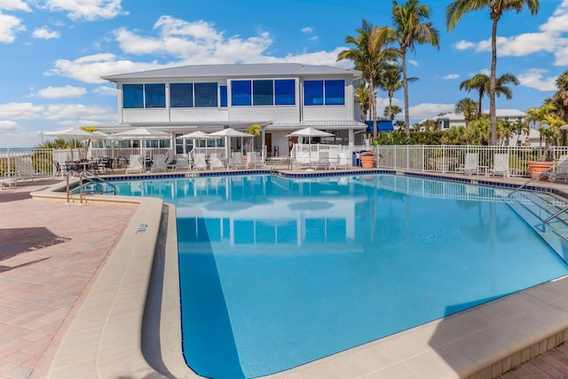 view of swimming pool with a patio area