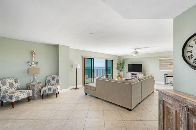 tiled living room featuring ceiling fan