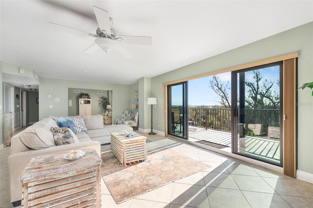 tiled living room with ceiling fan