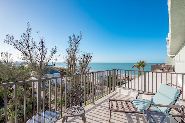 balcony with a view of the beach and a water view