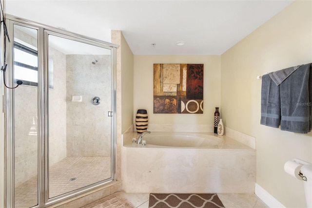 bathroom featuring tile patterned floors and plus walk in shower