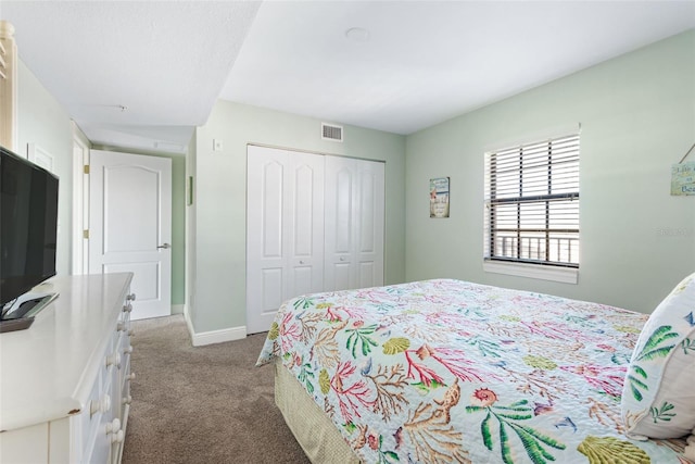 bedroom featuring a closet and carpet floors