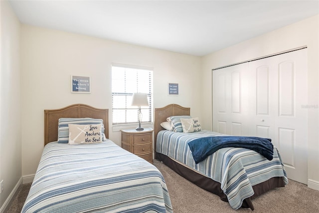 bedroom featuring a closet and carpet floors