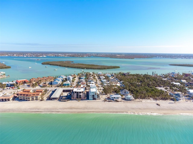 bird's eye view with a water view and a view of the beach