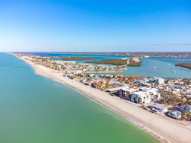 drone / aerial view with a beach view and a water view