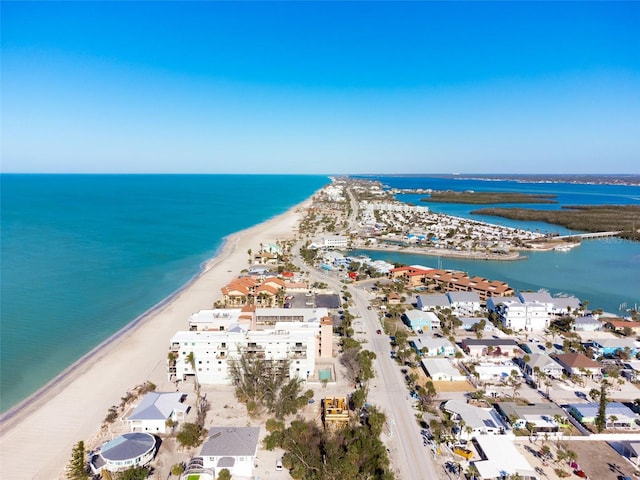 aerial view with a water view and a view of the beach