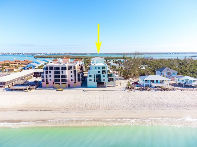 aerial view with a view of the beach and a water view