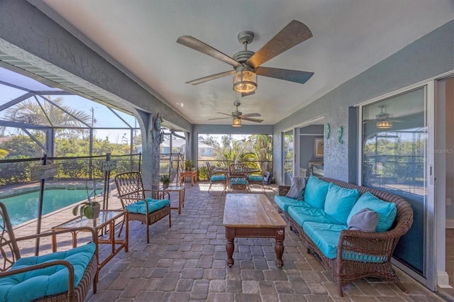 sunroom with ceiling fan