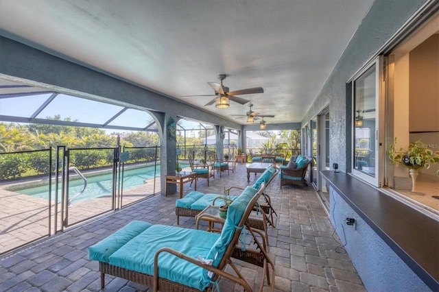 sunroom / solarium with a swimming pool