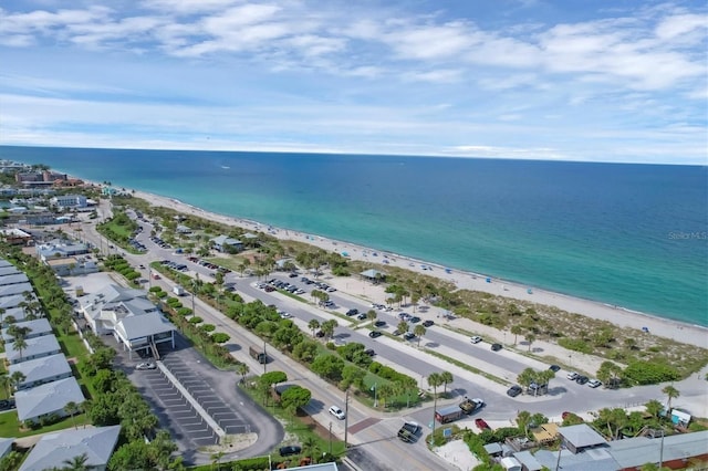 bird's eye view with a water view and a beach view