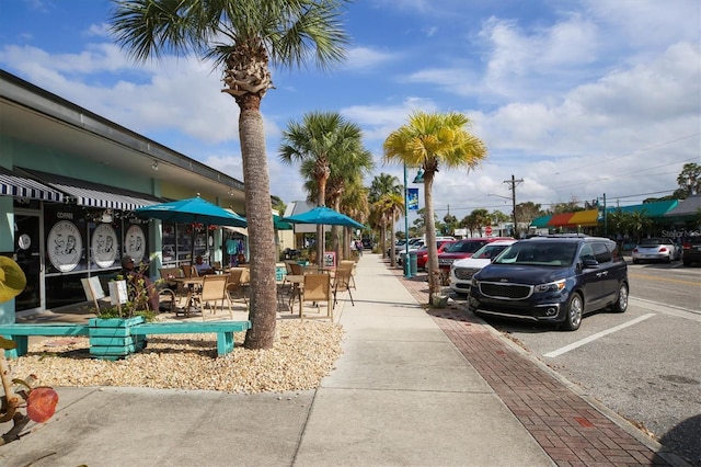 view of community with uncovered parking