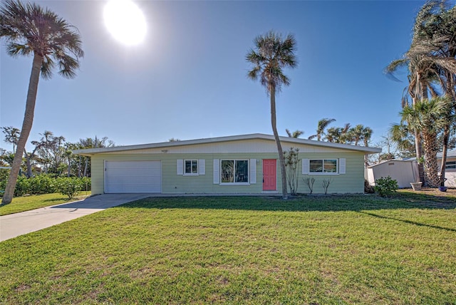 ranch-style home featuring a garage and a front lawn