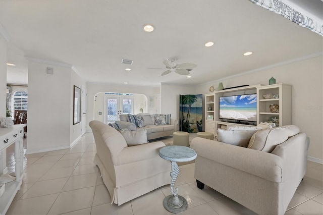 living room featuring crown molding, french doors, ceiling fan, and light tile patterned floors