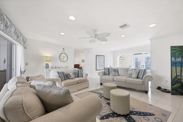 living room featuring light tile patterned floors, french doors, ceiling fan, and crown molding