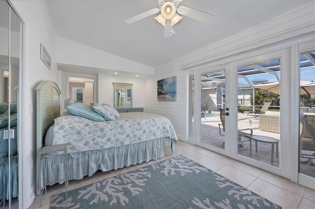 tiled bedroom featuring access to outside, vaulted ceiling, multiple windows, and ceiling fan