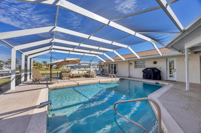 view of pool with a patio area, an outdoor living space, area for grilling, and glass enclosure