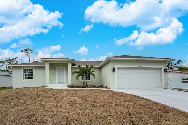 single story home featuring a front yard and a garage